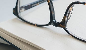 glasses on a notebook